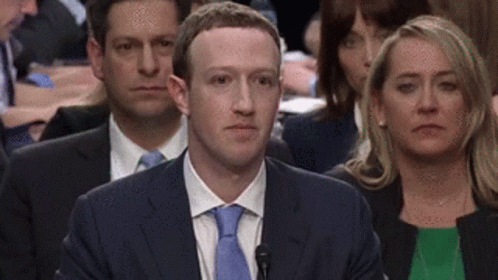 Zuckerberg smiling in an unsettling way